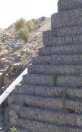 Gabion faced wall supports heavy loads act quarry 1690X831